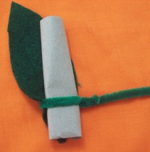 Secure the pipecleaner around both the pipecleaner and the felt leaf